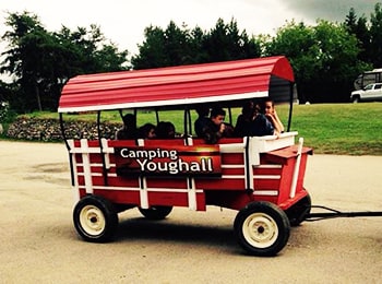 Camping Youghall cart with people